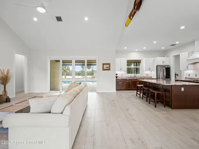 a view of an empty room with a fireplace