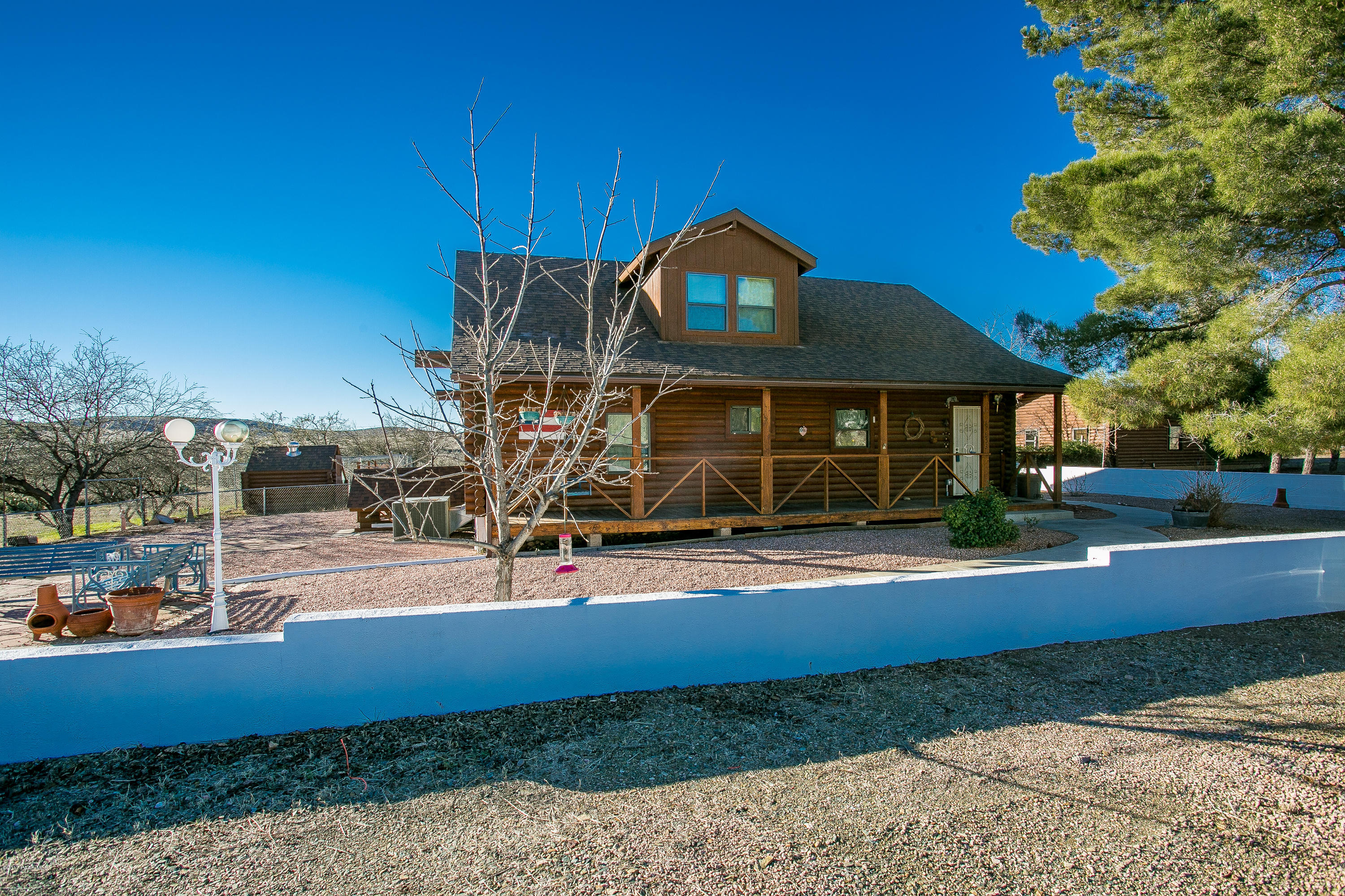 17653 East Trails End Road Spring Valley, AZ 86333 - Photo 1 of 18 a front view of a house with garden