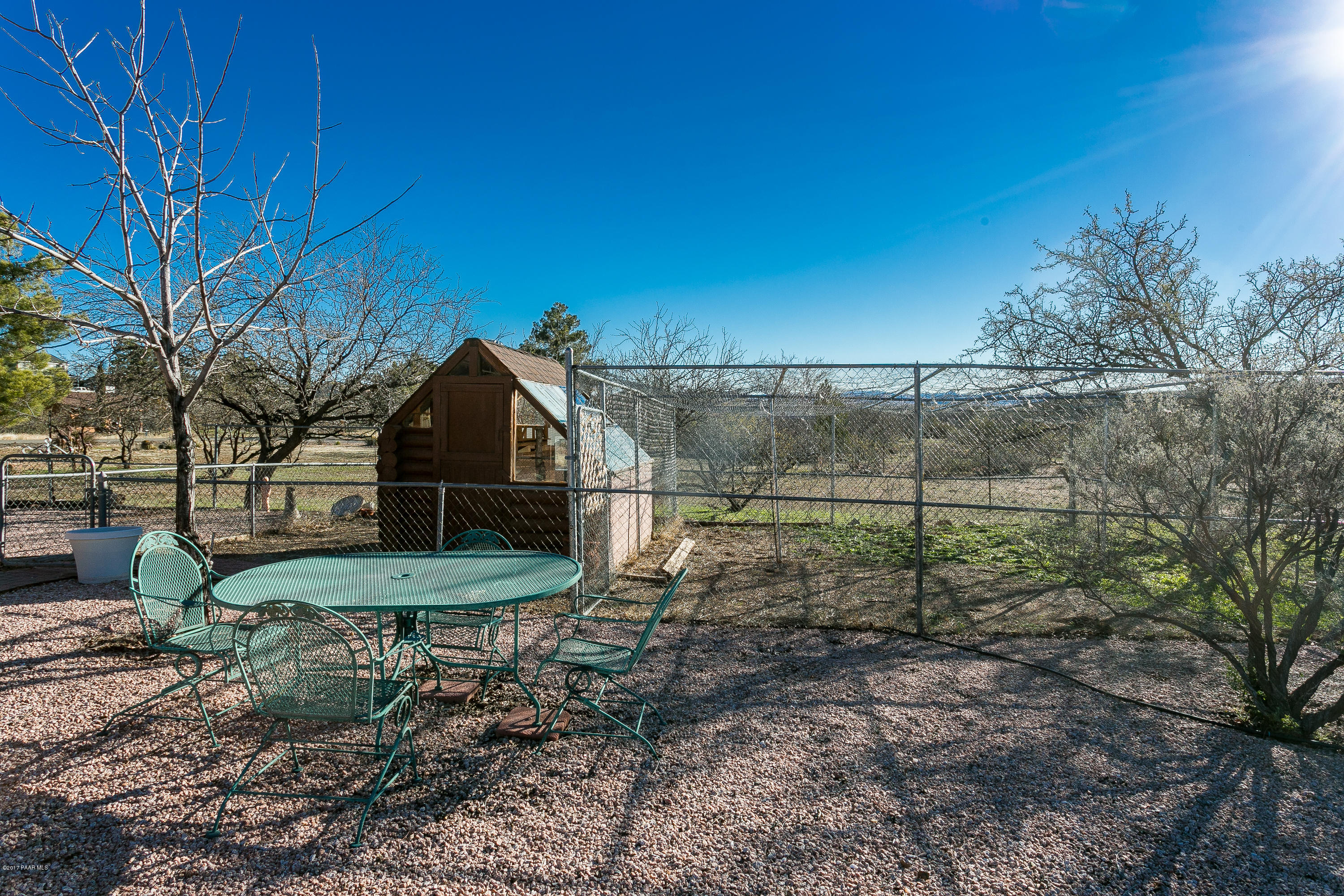 17653 East Trails End Road Spring Valley, AZ 86333 - Photo 14 of 18 a backyard of a house with table and chairs