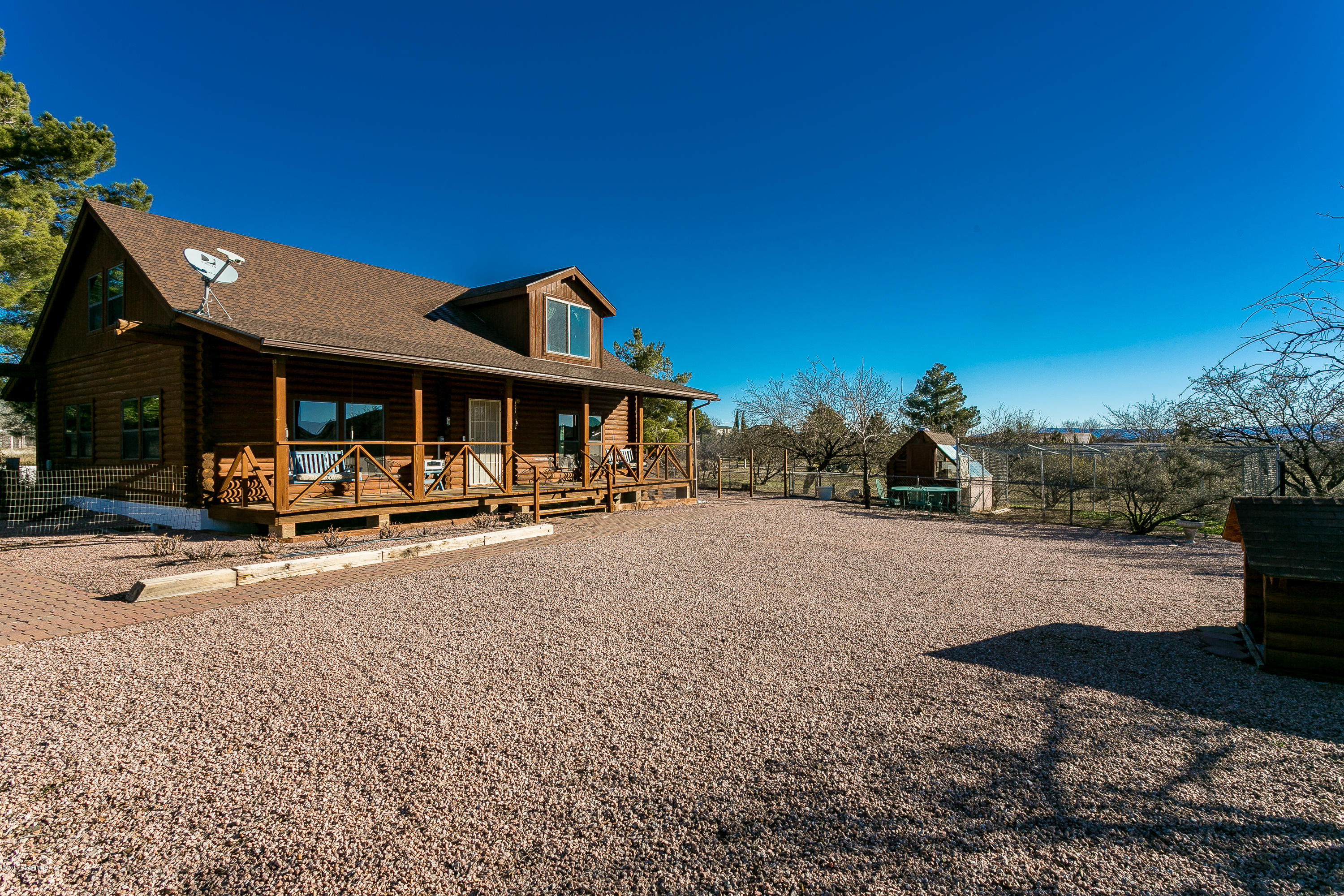 17653 East Trails End Road Spring Valley, AZ 86333 - Photo 15 of 18 a view of a house with swimming pool and sitting area
