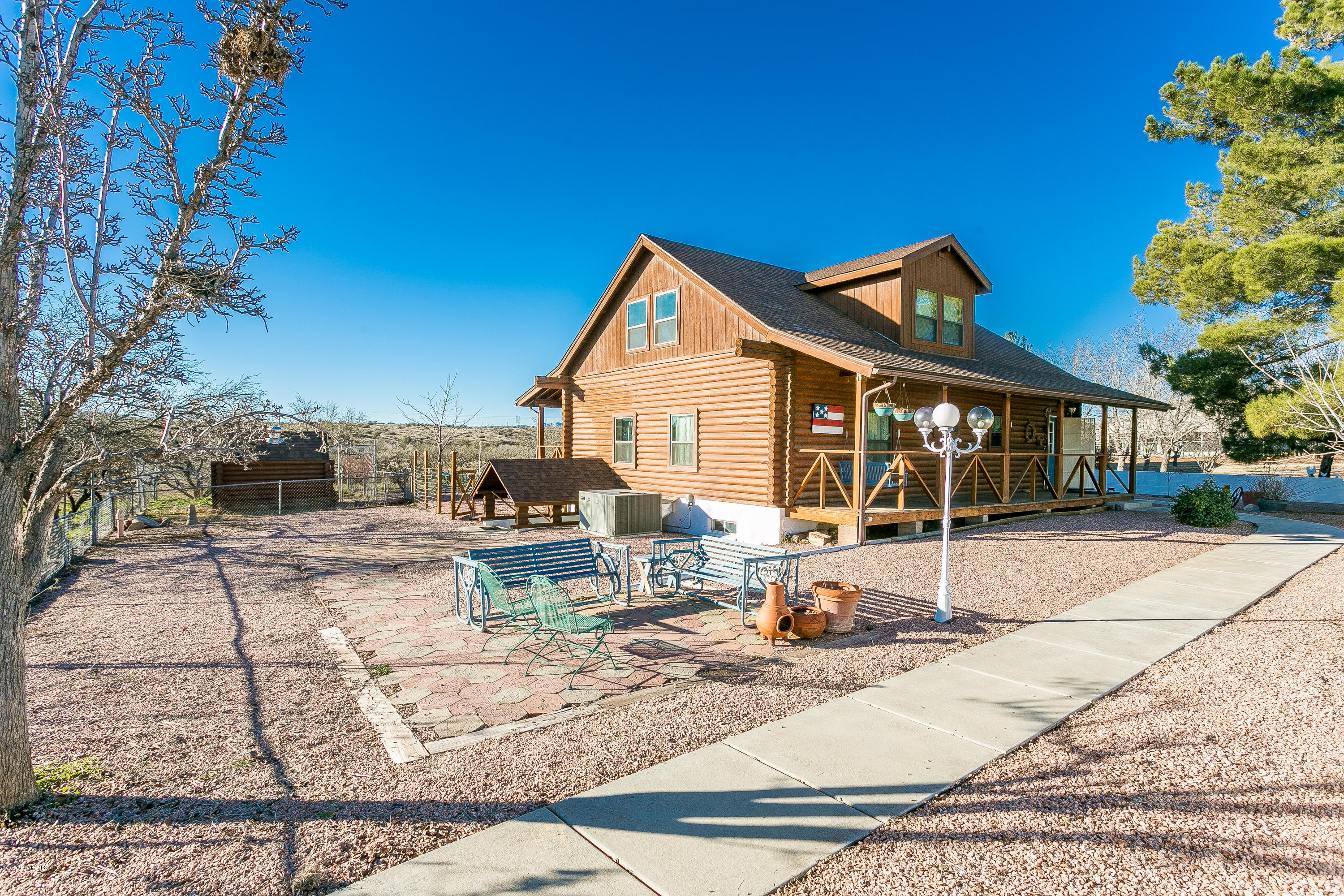 17653 East Trails End Road Spring Valley, AZ 86333 - Photo 2 of 18 a front view of a house with garden