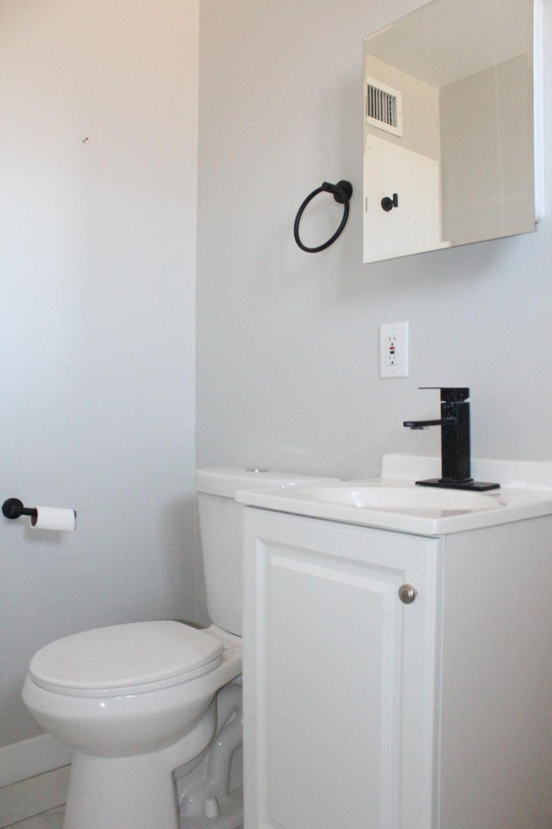 3932 West Griswold Road Phoenix, AZ 85051 - Photo 12 of 20 a bathroom with a sink a toilet and mirror