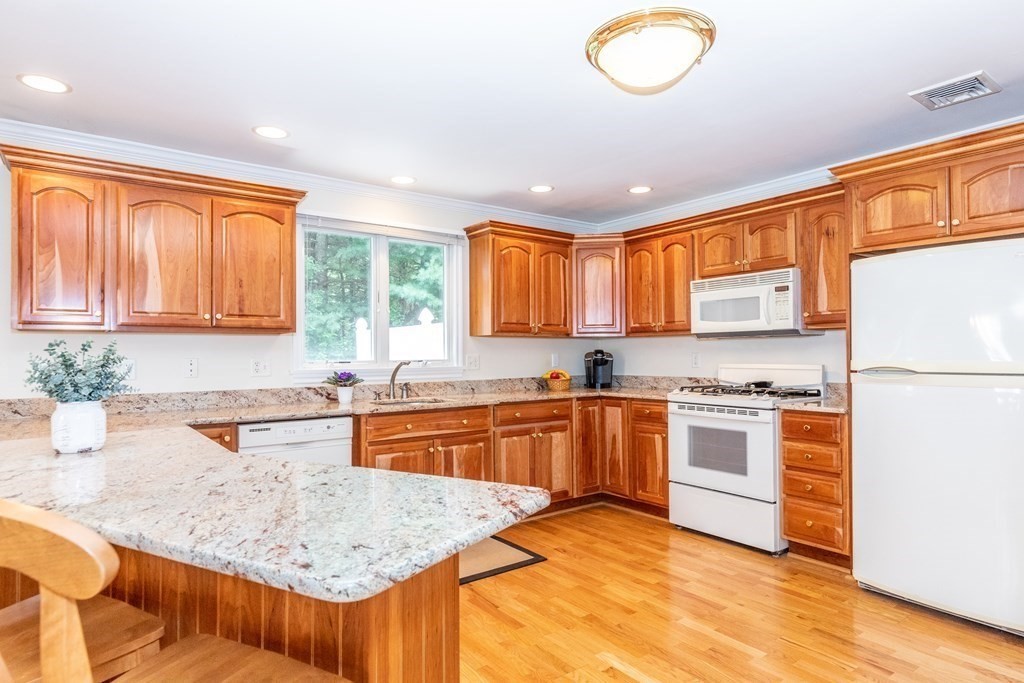216 Rangeway Road, Unit 161 Billerica, MA 01862 - Photo 13 of 39 a kitchen with stainless steel appliances granite countertop a stove a sink dishwasher and a refrigerator