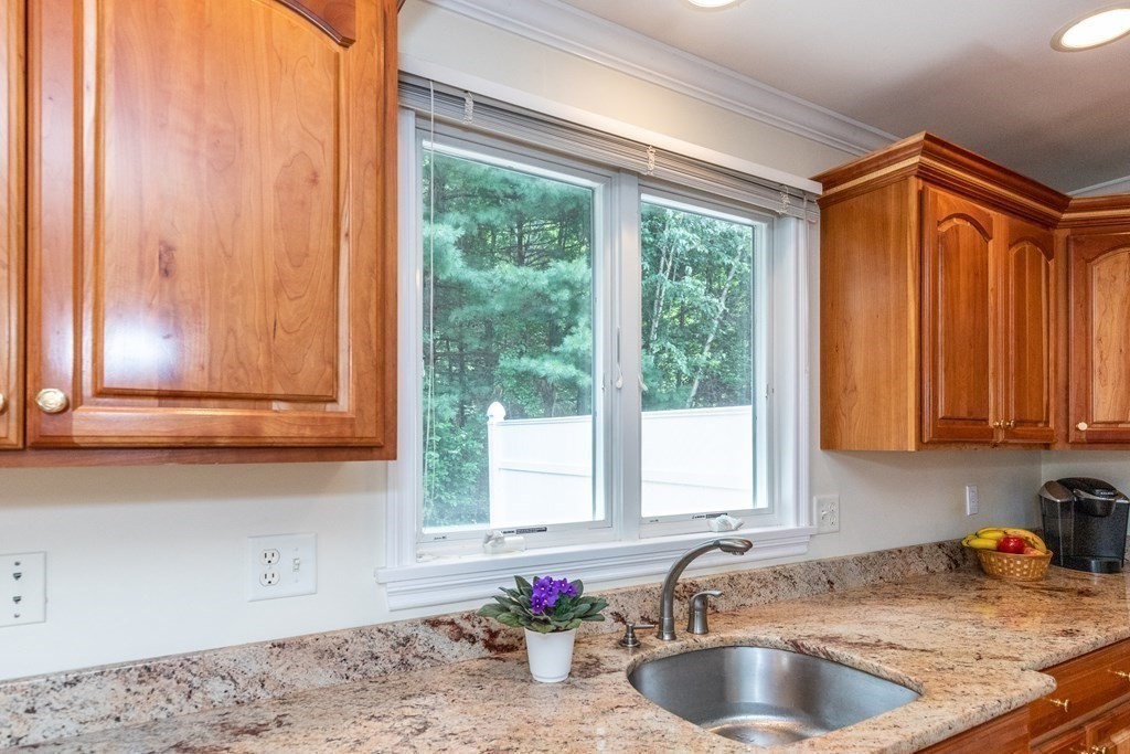 216 Rangeway Road, Unit 161 Billerica, MA 01862 - Photo 14 of 39 a kitchen with granite countertop a sink and a window