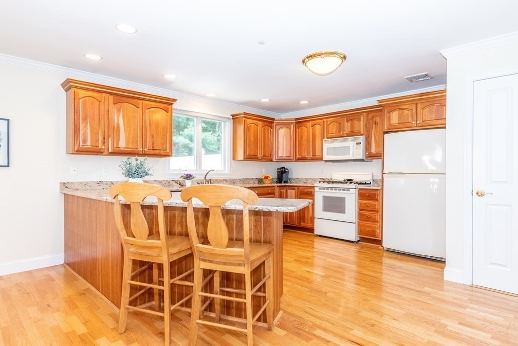 216 Rangeway Road, Unit 161 Billerica, MA 01862 - Photo 16 of 39 a kitchen with a sink appliances and cabinets