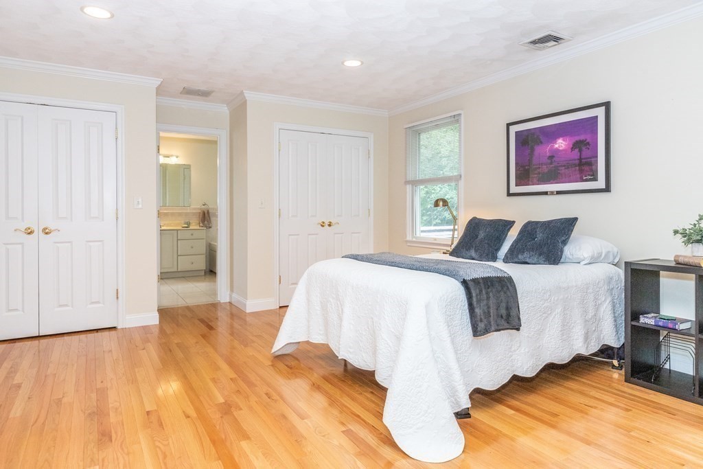 216 Rangeway Road, Unit 161 Billerica, MA 01862 - Photo 23 of 39 a bedroom with a bed and wooden floor
