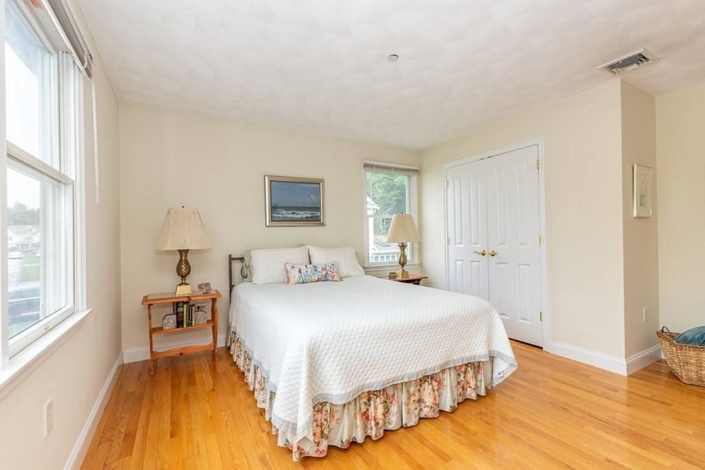 216 Rangeway Road, Unit 161 Billerica, MA 01862 - Photo 27 of 39 a bedroom with a bed and wooden floor