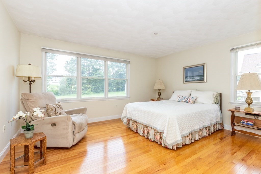 216 Rangeway Road, Unit 161 Billerica, MA 01862 - Photo 28 of 39 a spacious bedroom with a bed and a couch