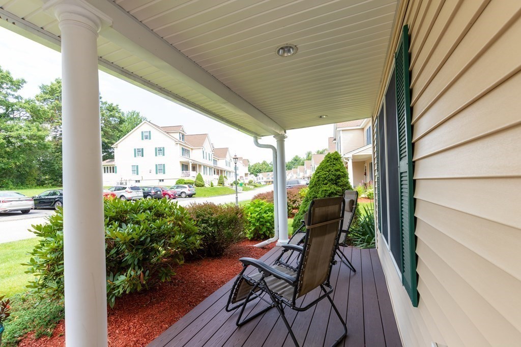 216 Rangeway Road, Unit 161 Billerica, MA 01862 - Photo 3 of 39 a view of a chairs and table in patio next to a yard