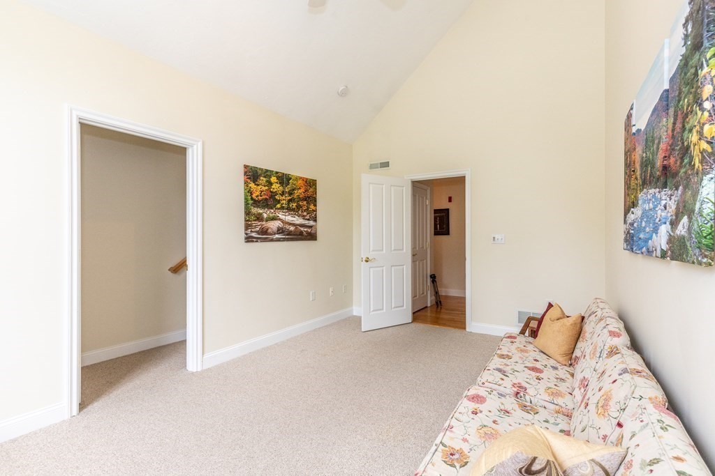 216 Rangeway Road, Unit 161 Billerica, MA 01862 - Photo 31 of 39 a bedroom with a bed and a painting on the wall