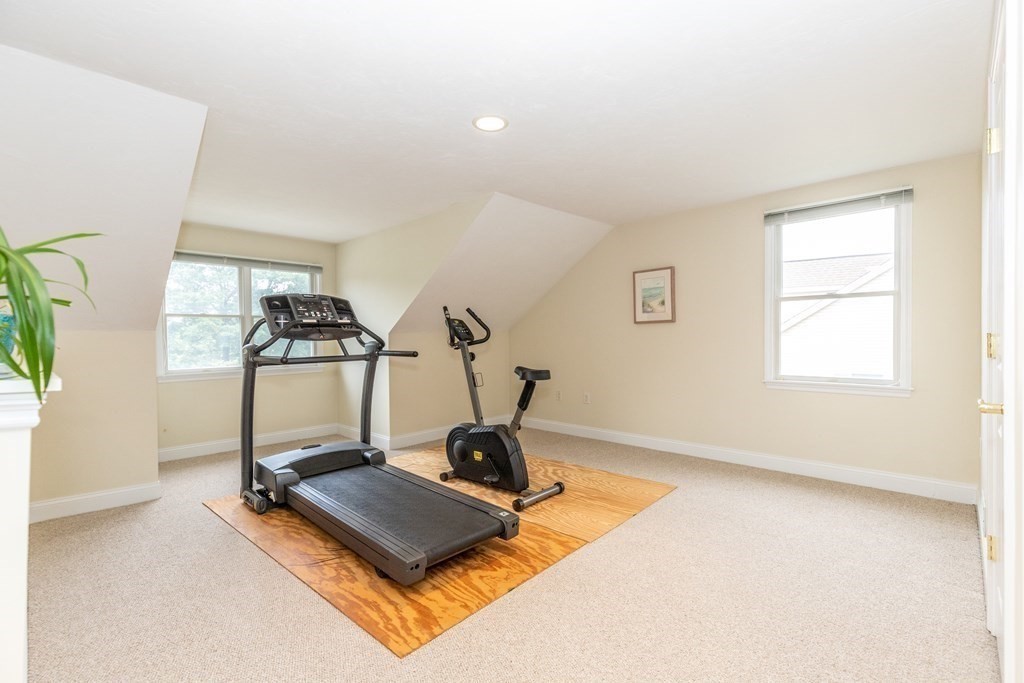 216 Rangeway Road, Unit 161 Billerica, MA 01862 - Photo 34 of 39 a room with gym equipment and windows