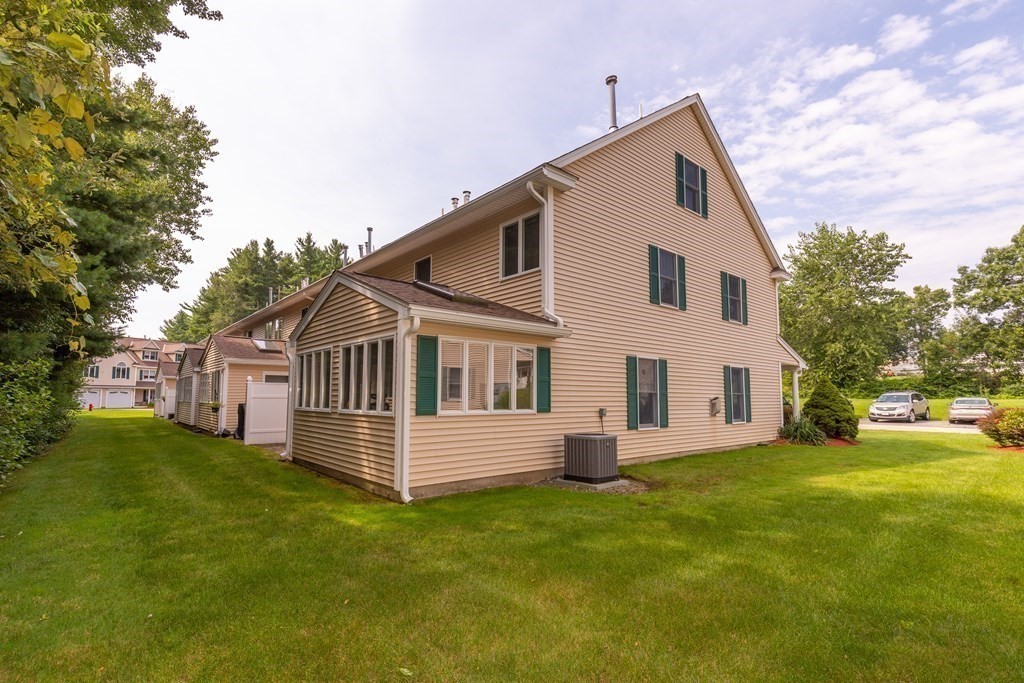 216 Rangeway Road, Unit 161 Billerica, MA 01862 - Photo 36 of 39 a front view of a house with a garden