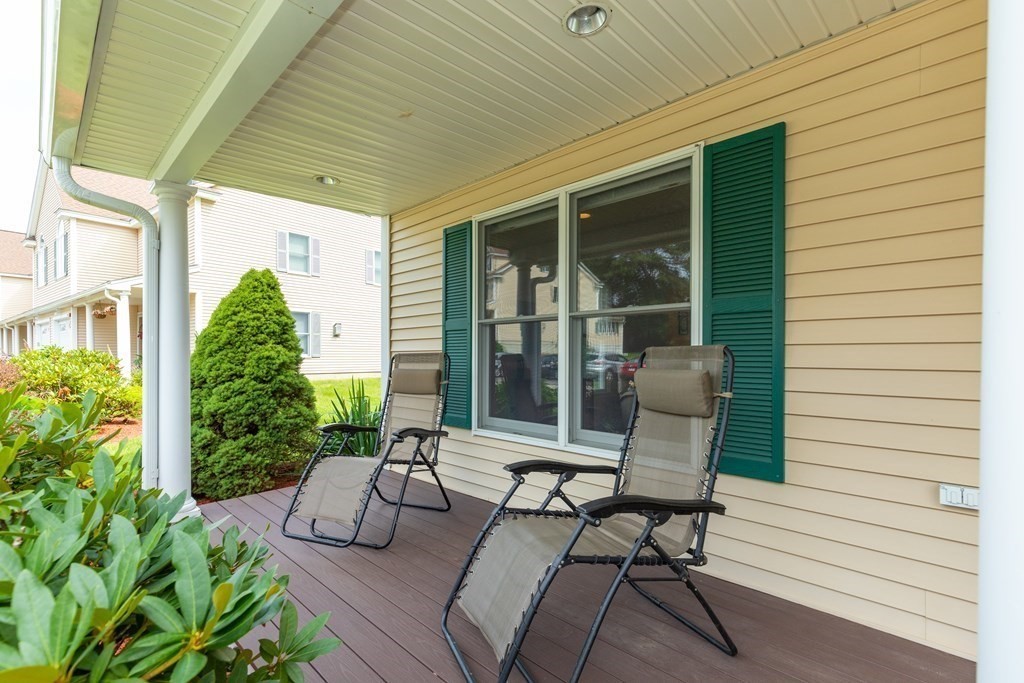 216 Rangeway Road, Unit 161 Billerica, MA 01862 - Photo 4 of 39 a view of a patio with couple of chairs and a potted plant