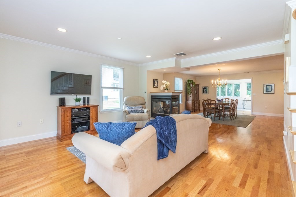 216 Rangeway Road, Unit 161 Billerica, MA 01862 - Photo 5 of 39 a living room with furniture and a flat screen tv