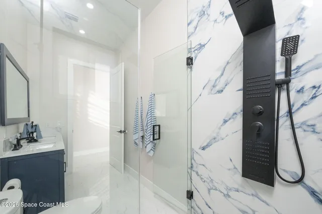 a bathroom with a bathtub and shower