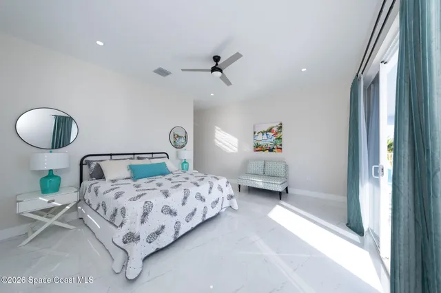 a bedroom with a bed and window