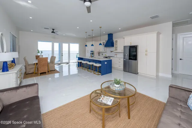 a view of kitchen with stainless steel appliances kitchen island