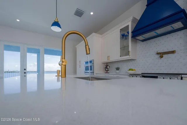 a kitchen with a stove and cabinets