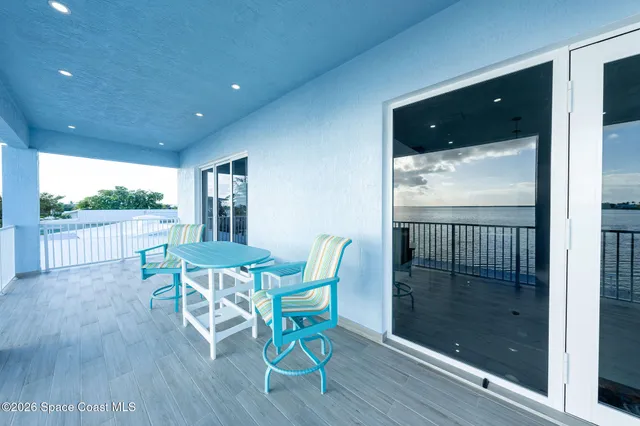 a bathroom with a double vanity sink mirror double shower and a toilet