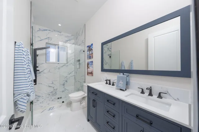 a bathroom with a sink and shower