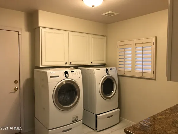 a utility room with dryer and washer