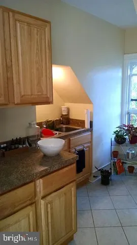 a kitchen with a stove and a cabinet
