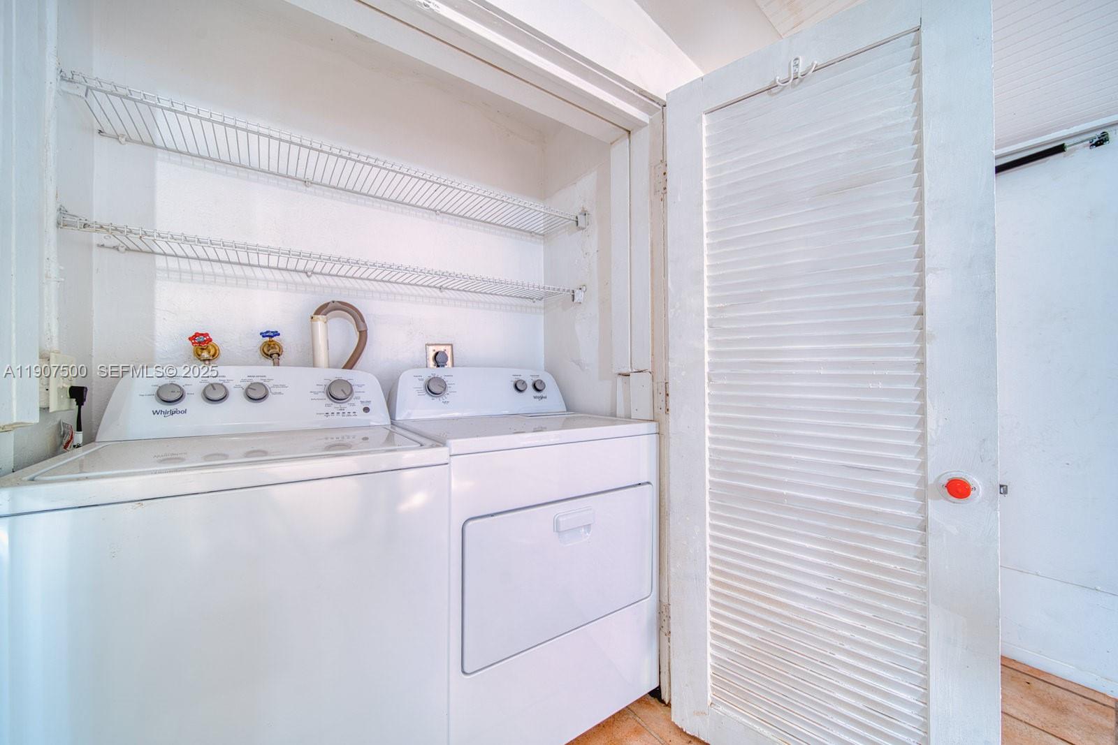 400 Minorca Avenue, Unit 1 Coral Gables, FL 33134 - Photo 4 of 21 a bathroom with a sink and a mirror