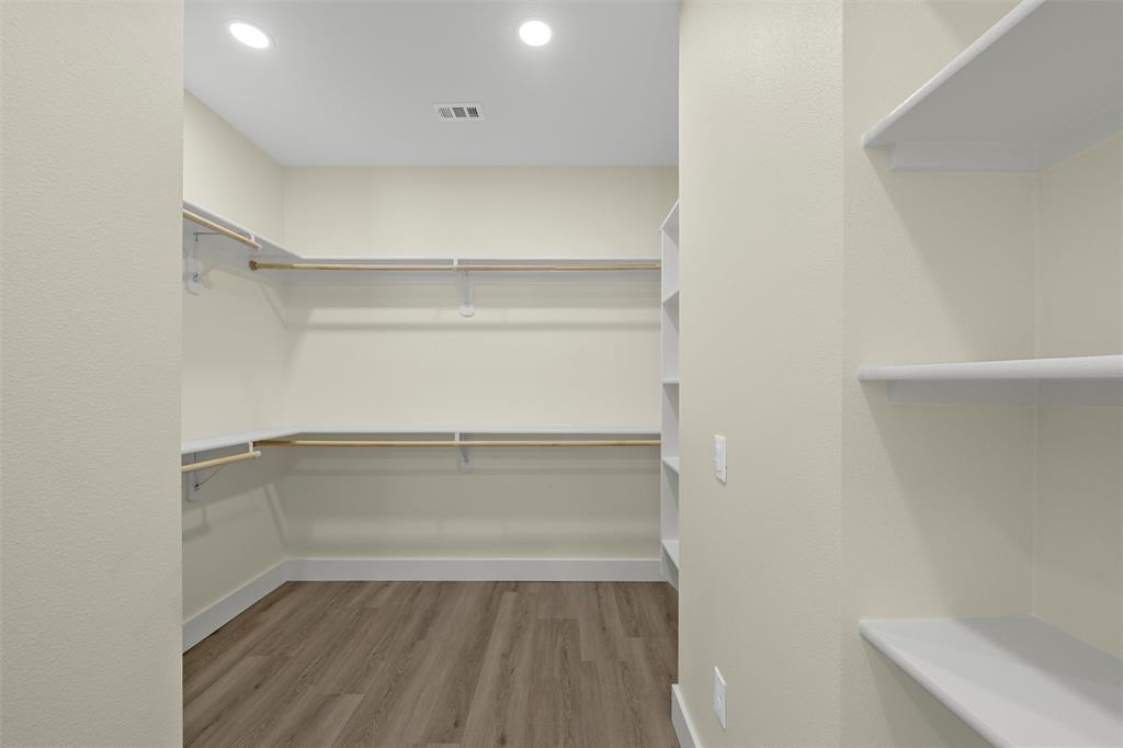 3320 North 27th Street Waco, TX 76708 - Photo 23 of 38 a view of walk in closet with empty racks