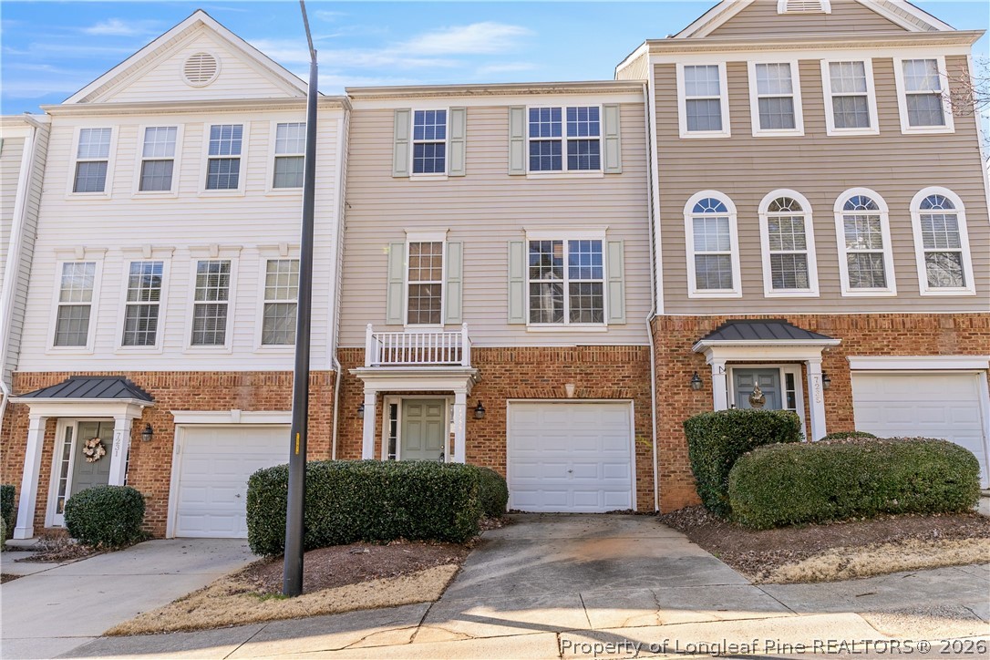 7233 Galon Glen Road Raleigh, NC 27613 - Photo 1 of 6 a front view of a house with a yard