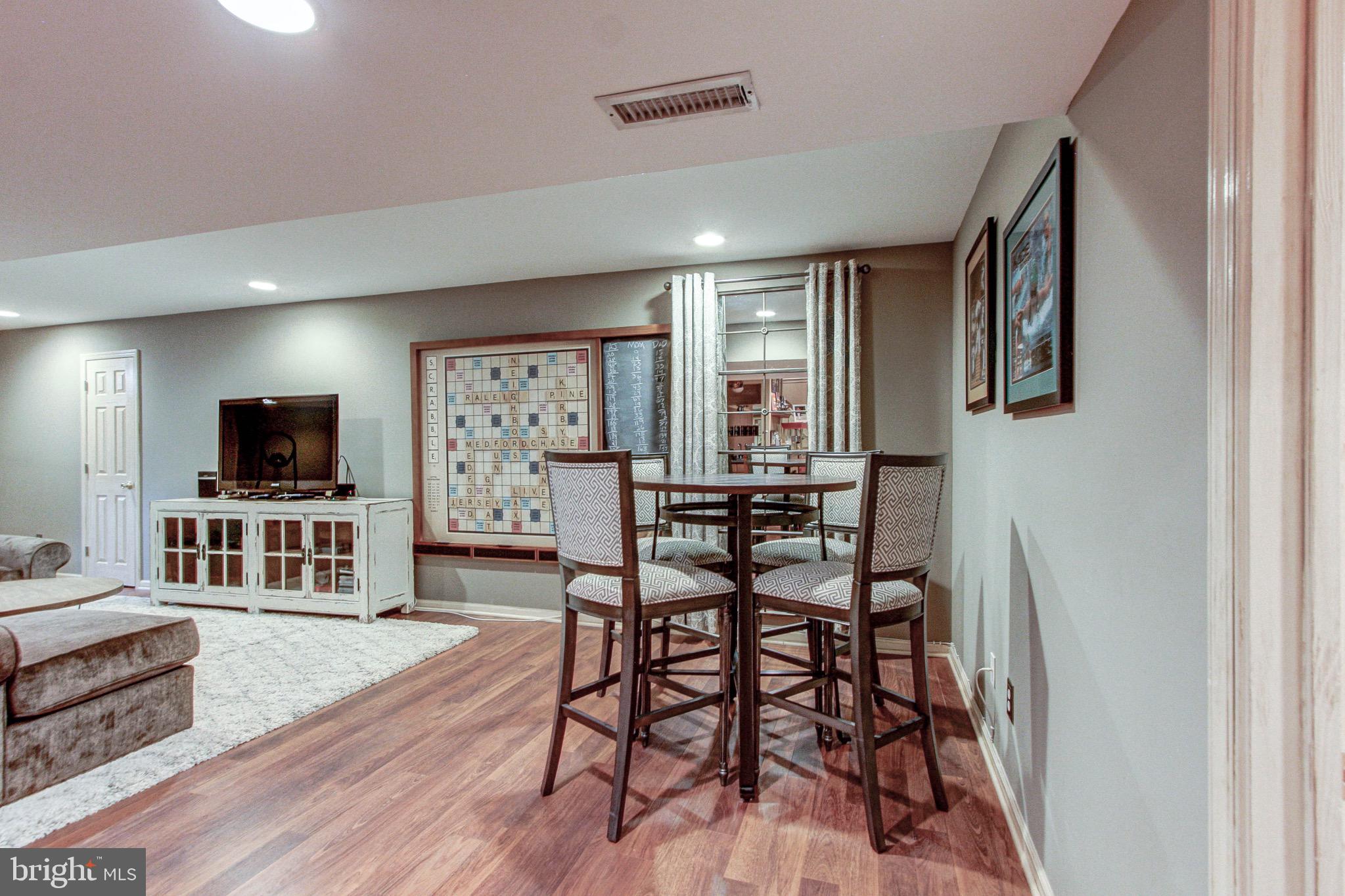 3 Raleigh Circle Medford, NJ 08055 - Photo 32 of 41 Finished basement with laminate flooring