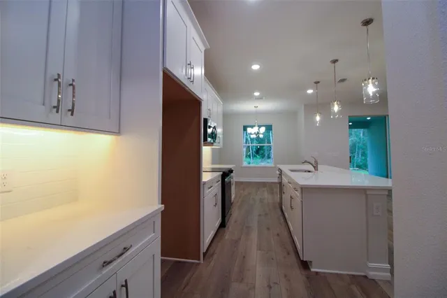 a view of living room with wooden floor
