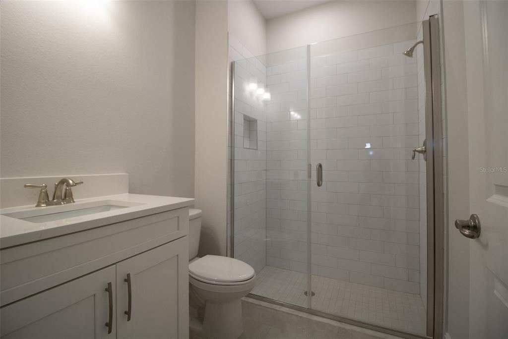 159 North Kinglet Avenue Hernando, FL 34442 - Photo 9 of 33 a bathroom with a granite countertop sink a toilet and shower