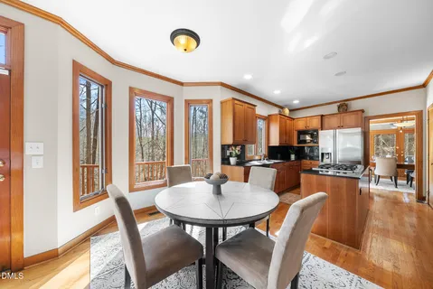 a kitchen with stainless steel appliances granite countertop a stove and a refrigerator