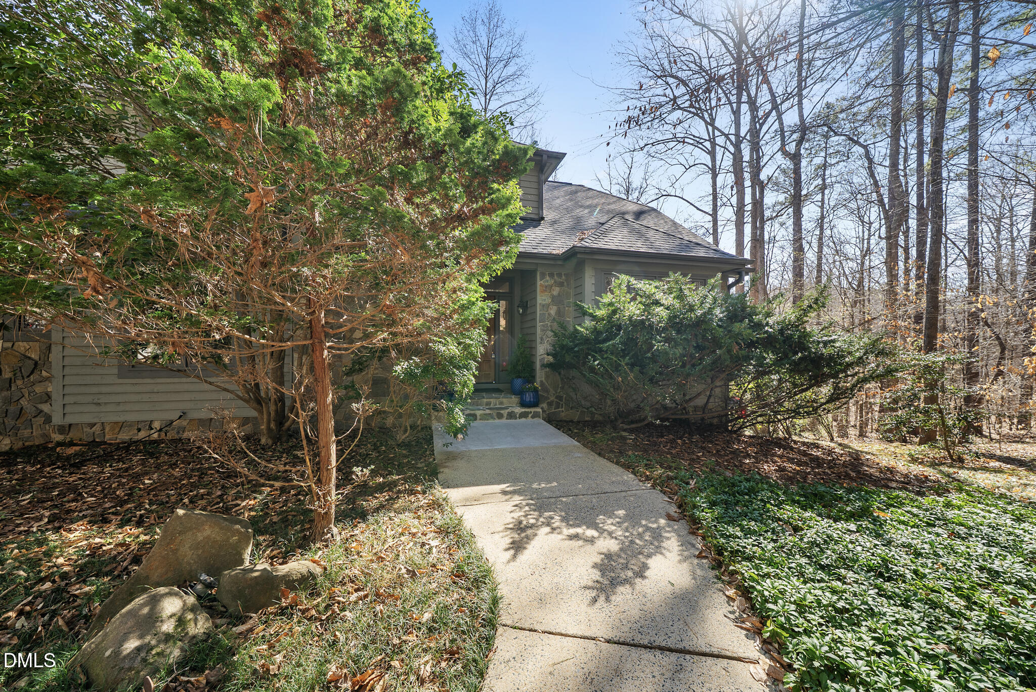 5306 Taproot Lane Durham, NC 27705 - Photo 2 of 7 a view of a pathway both side of house
