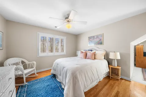 a bed room with a bed and a chandelier