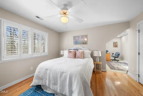 a bedroom with furniture and a window