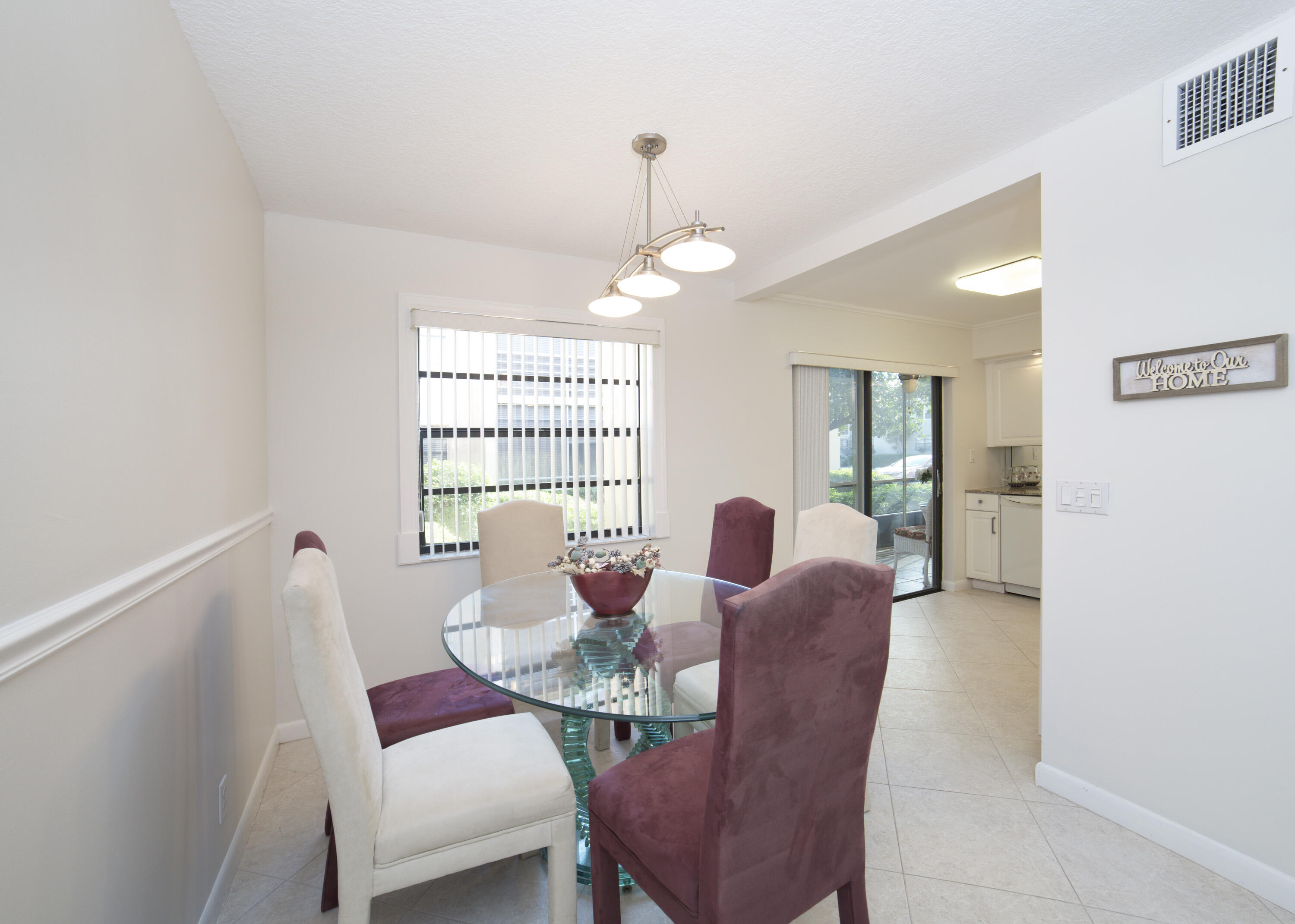 247 Capri F Delray Beach, FL 33484 - Photo 3 of 30 a dining room with furniture and window
