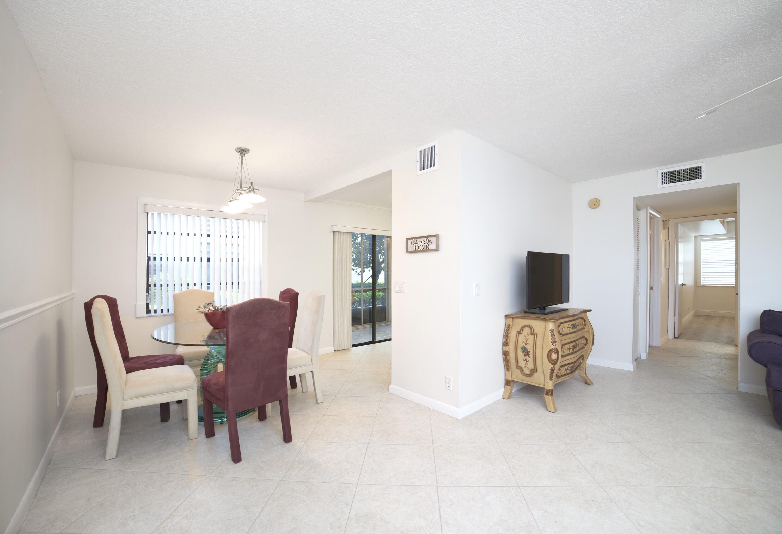 247 Capri F Delray Beach, FL 33484 - Photo 4 of 30 a view of a livingroom with furniture and a window