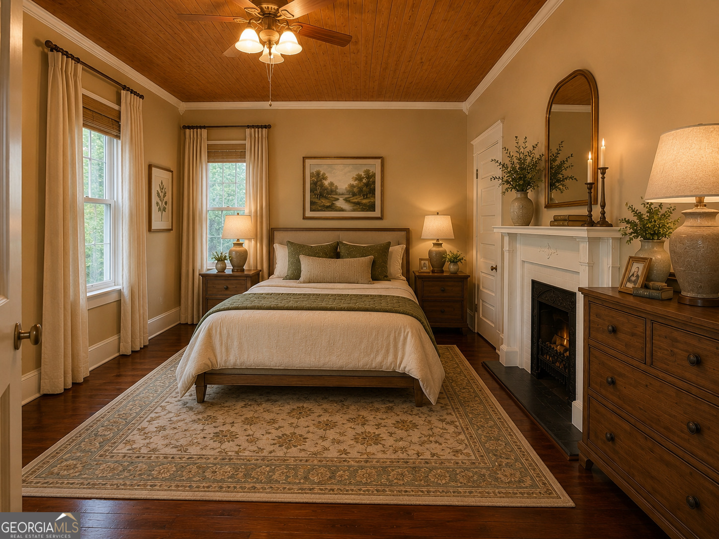 316 West Church Street Fort Valley, GA 31030 - Photo 12 of 28 a spacious bedroom with a bed a mirror on dresser and a chandelier