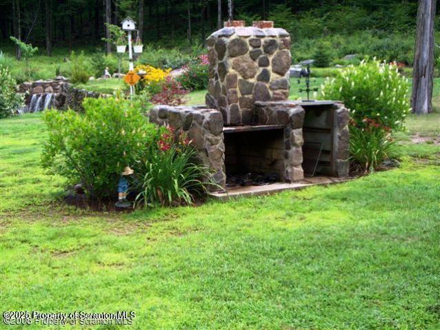 193 Flat Rock Road Forest City, PA 18421 - Photo 8 of 55 193 Flat Rock outdoor fireplace