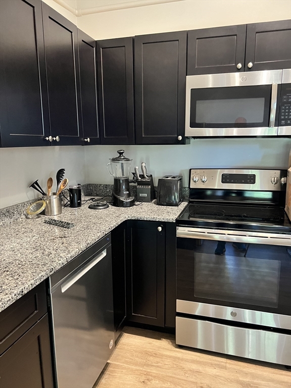 54 Longmeadow Road, Unit 5 Taunton, MA 02780 - Photo 3 of 10 a kitchen with a sink and cabinets