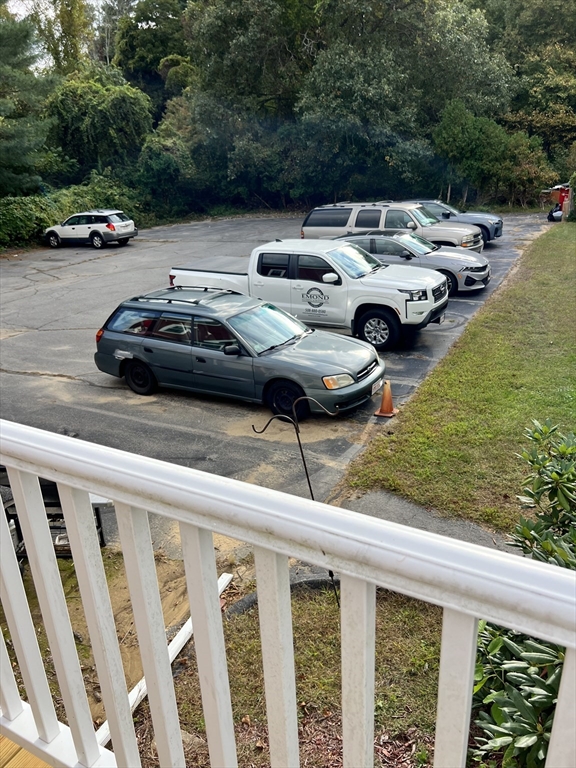 54 Longmeadow Road, Unit 5 Taunton, MA 02780 - Photo 10 of 10 a couple of cars parked in front of a house