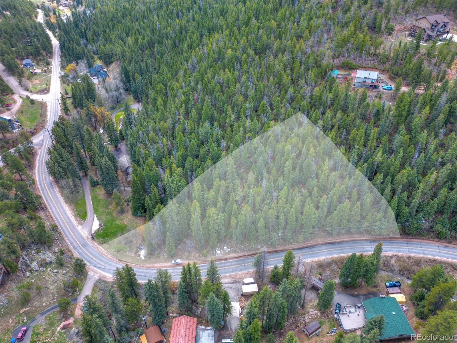8116 South Brook Forest Road Evergreen, CO 80439 - Photo 4 of 18 a aerial view of a house