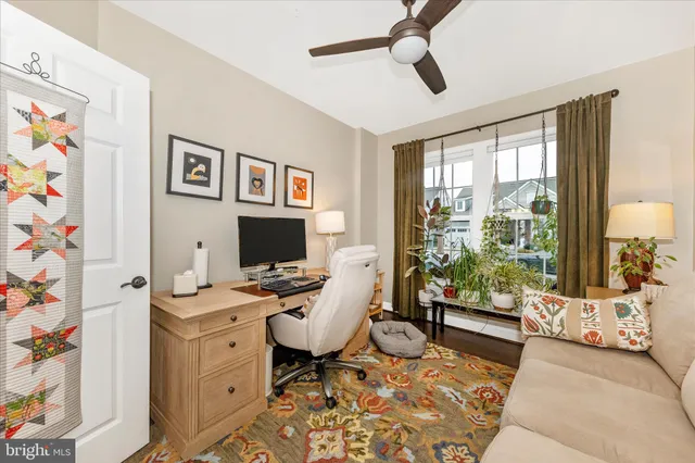 a bathroom with a granite countertop toilet sink and mirror