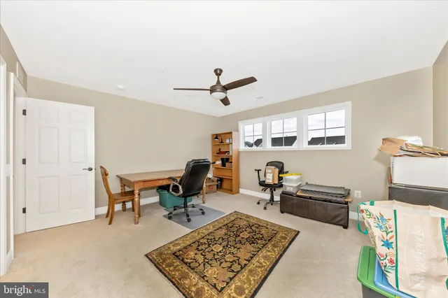 a view of a house with swimming pool and sitting area