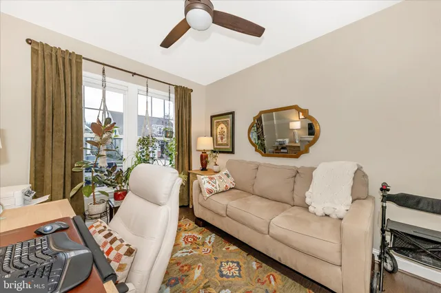 a view of a room with rug and wooden floor