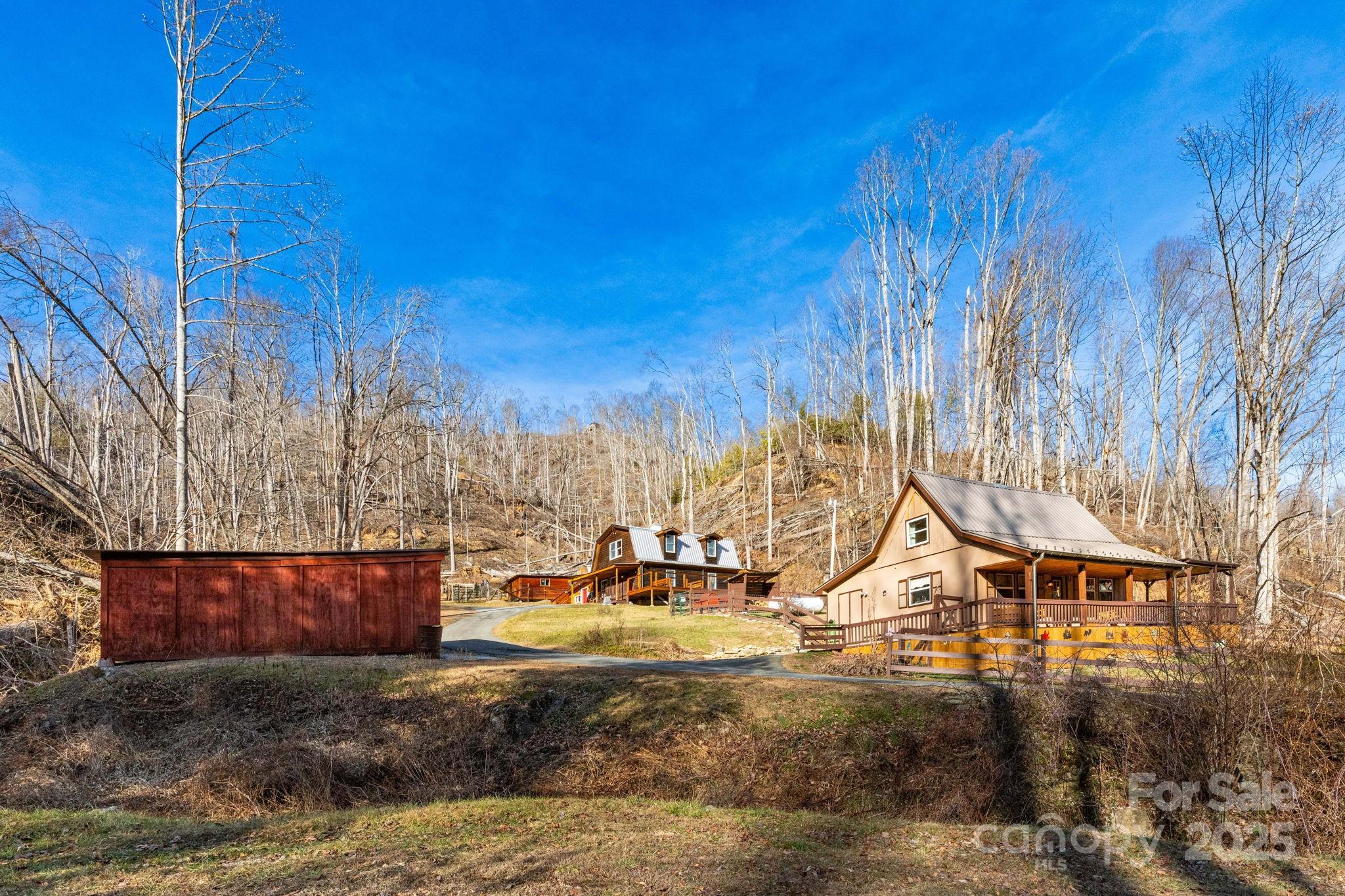 1010 Melton Branch Road Bakersville, NC 28705 - Photo 1 of 43 a view of a house with a yard