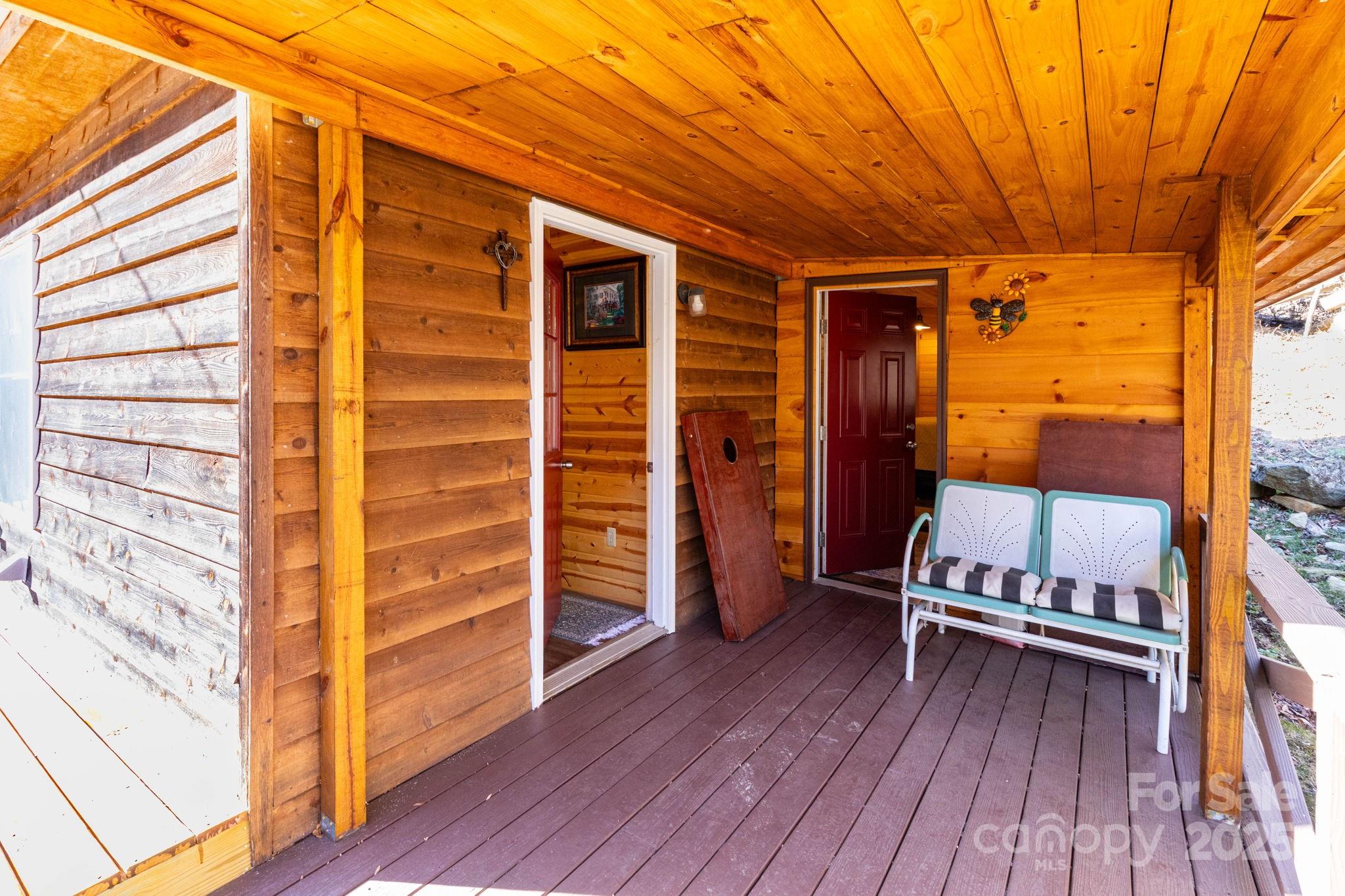 1010 Melton Branch Road Bakersville, NC 28705 - Photo 12 of 43 a view of outdoor space with wooden floor and furniture