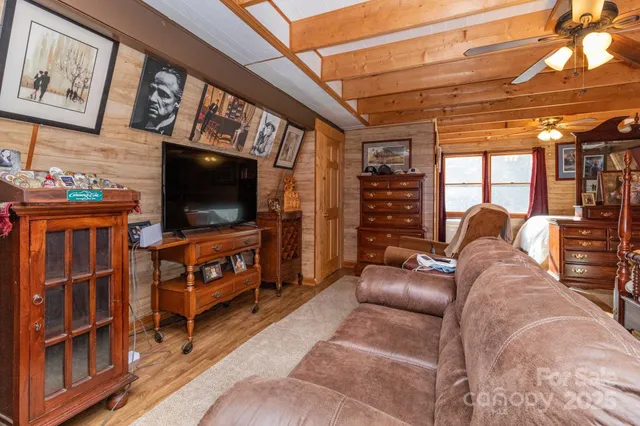 a dining room with furniture a window and chandelier