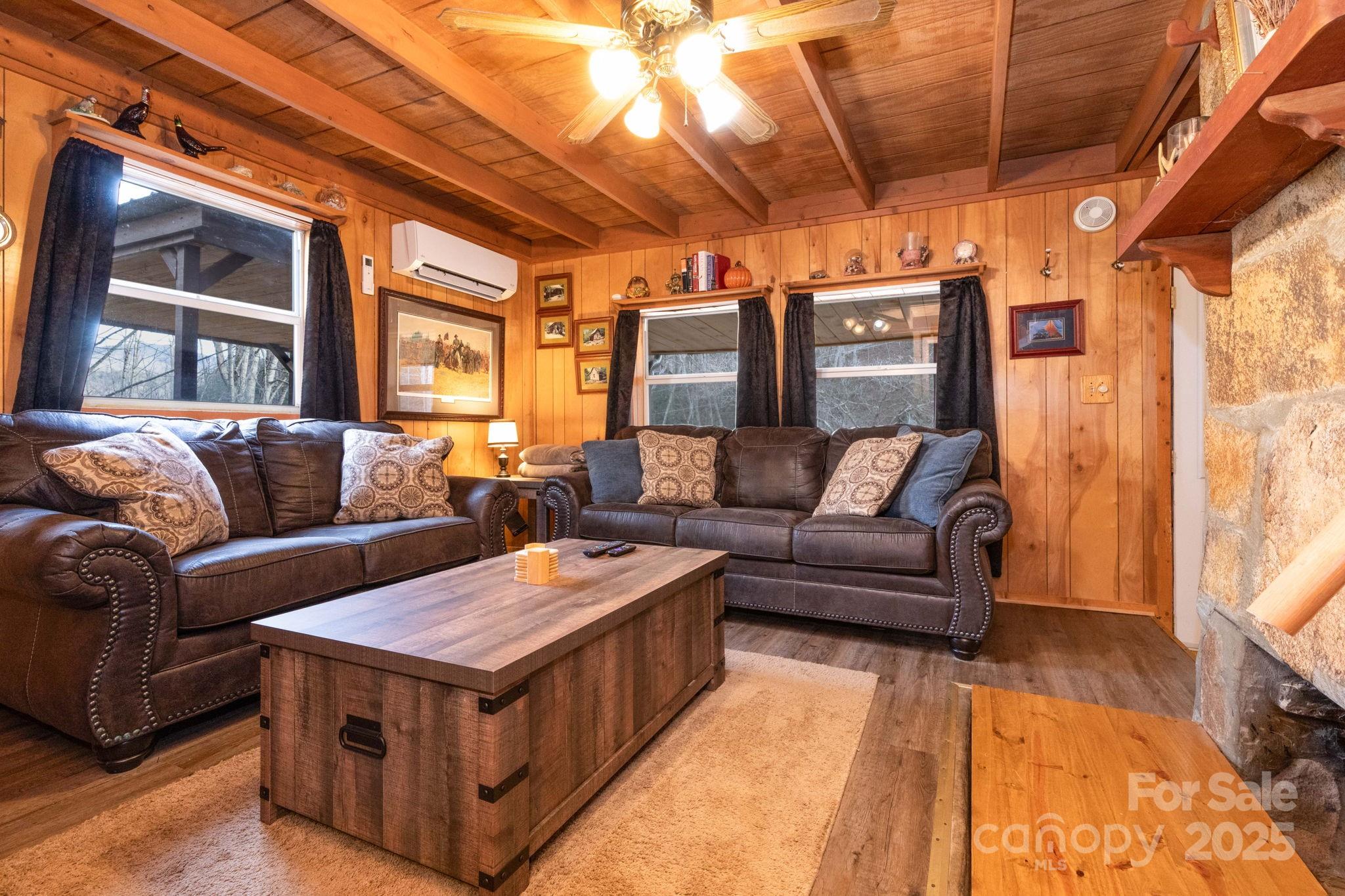 1010 Melton Branch Road Bakersville, NC 28705 - Photo 23 of 43 a living room with furniture and a flat screen tv